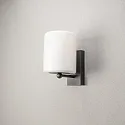 Konstsmide Luminaria de pared para exteriores PORTICI cilíndrico, con difusor E27 IP44, negro mate regulable