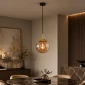 Steinhauer Luminaria colgante BOLLIQUE redondo E27 IP20, ámbar, latón, negro regulable